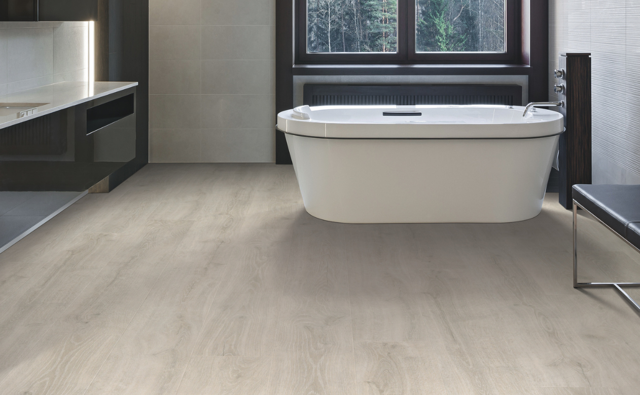 wood look laminate flooring in a bathroom with a bathtub