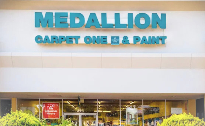 Medallion Carpet One & Paint flooring store sign and building.