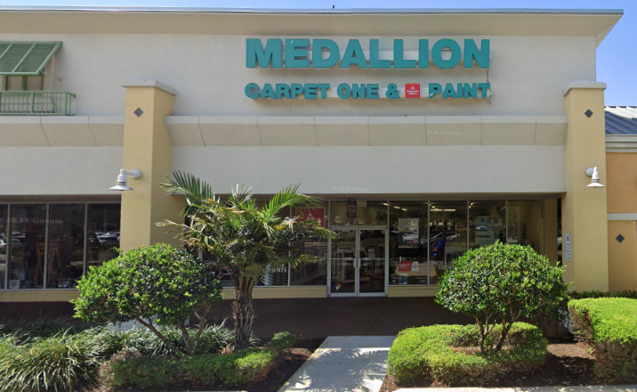 Medallion Carpet One & Paint flooring store sign and building.